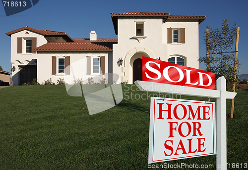 Image of Sold Home For Sale Sign & New House