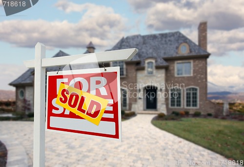 Image of Sold Home For Sale Sign in Front of New House 