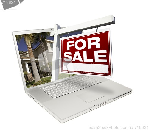 Image of Home for Sale Sign & New House on Laptop
