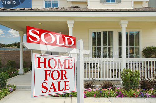 Image of Sold Home For Sale Sign & New House