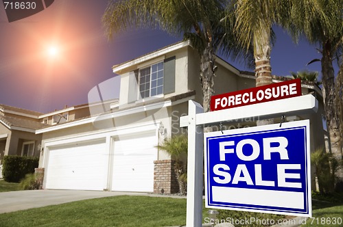 Image of Red Foreclosure For Sale Real Estate Sign and House