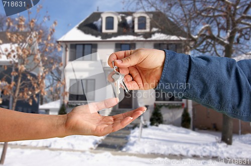 Image of Handing Over the House Keys in Front of New Home