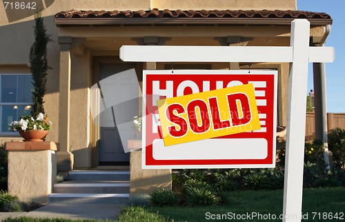 Image of Sold Home For Sale Sign and House