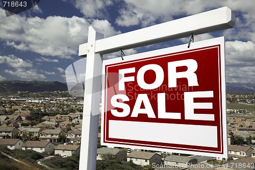 Image of For Sale Real Estate Sign with Elevated Housing Community View