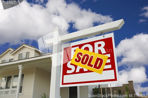 Image of Sold Home For Sale Sign in Front of New House 