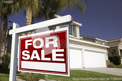 Image of For Sale Real Estate Sign and House
