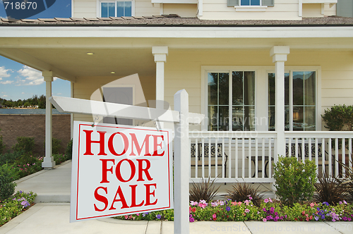 Image of Home For Sale Sign & New Home