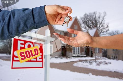 Image of Handing Over the House Keys in Front of New Home