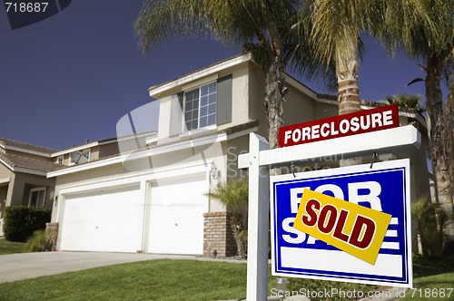 Image of Blue Foreclosure For Sale Real Estate Sign and House