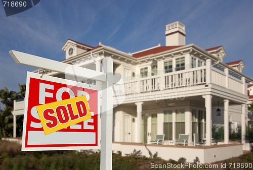 Image of Sold Home For Sale Sign in Front of New House 