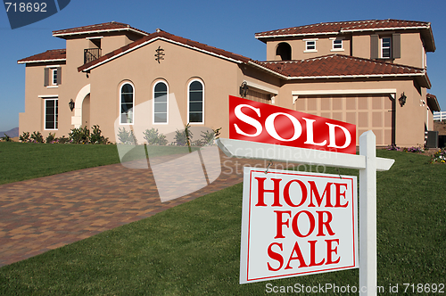 Image of Sold Home For Sale Sign & New House