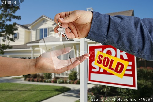 Image of Handing Over the House Keys in Front of New Home