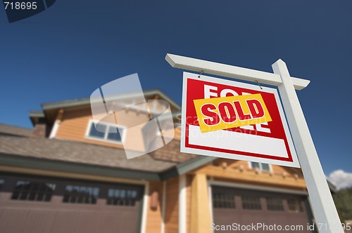 Image of Sold Home For Sale Sign in Front of New House 