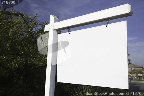 Image of Blank Real Estate Sign in Neighborhood