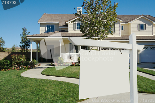 Image of Blank Real Estate Sign & New Home