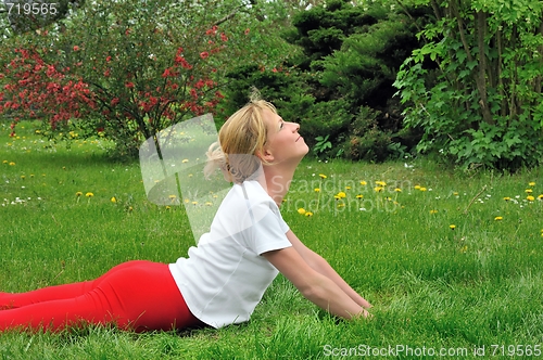 Image of Young woman doing yoga