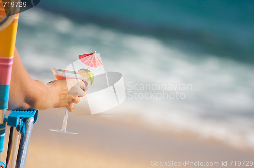 Image of Woman on Beach with Tropical Drink