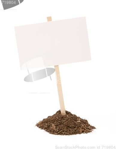 Image of Blank White Sign in Dirt Pile Isolated