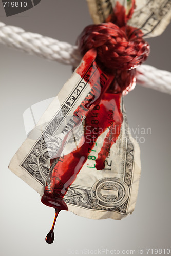 Image of Wrinkled American Dollar Bleeding in Rope