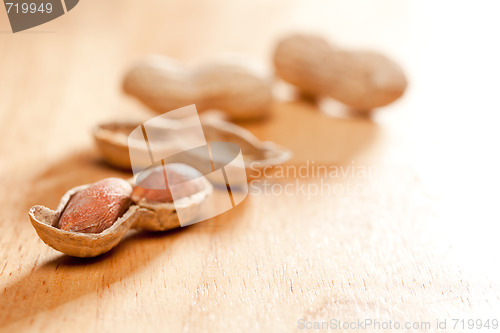 Image of Peanuts on Wood Background