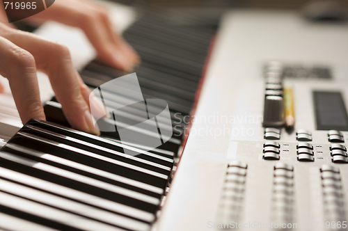 Image of Woman's Fingers on Digital Piano Keys