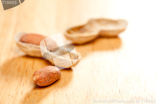 Image of Peanuts on Wood Background