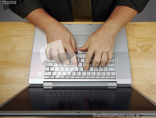 Image of Man Using Laptop