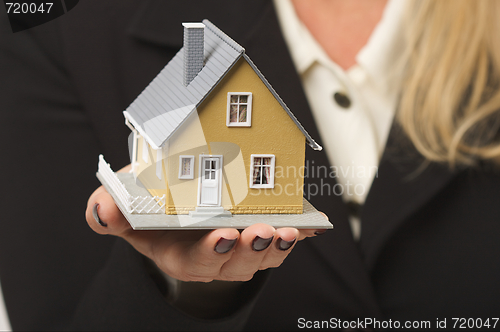 Image of House in Female Hand