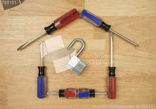 Image of House Shaped by Screwdrivers and Lock