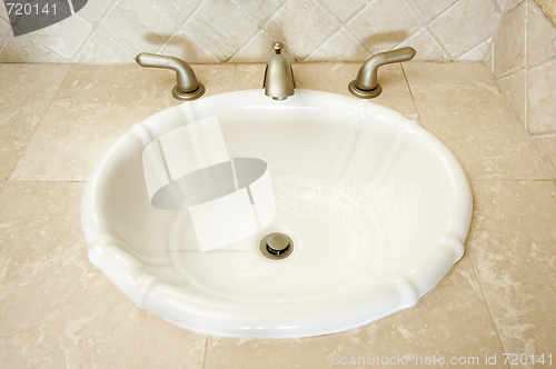 Image of Shell Sink and Faucet 