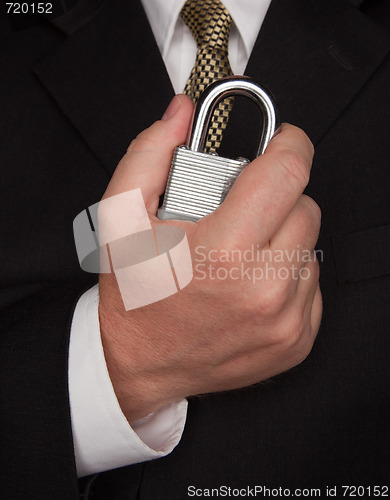 Image of Businessman Holding Large Lock
