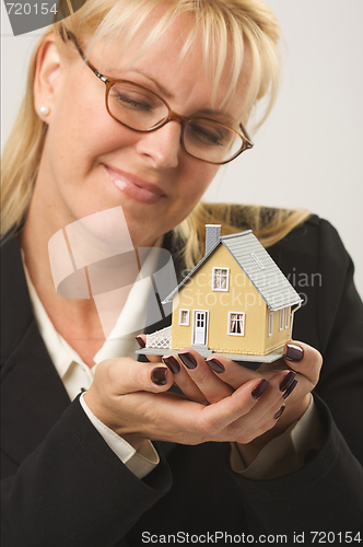 Image of Woman Holding House