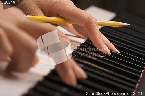 Image of Woman's Fingers on Digital Piano Keys