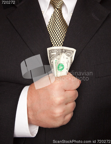 Image of Businessman Squeezing Dollar Bill