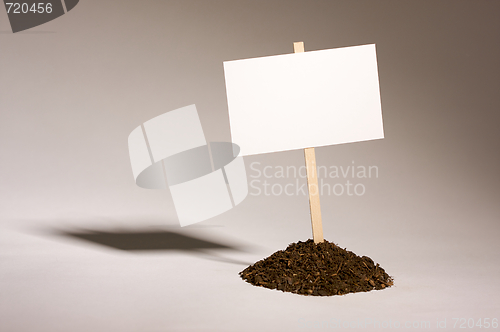 Image of Blank White Sign in Dirt Pile