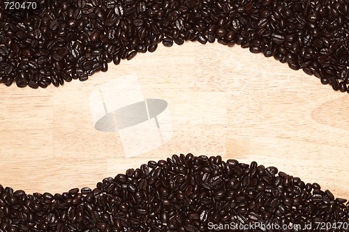 Image of Dark Roasted Coffee Beans on Wood Background