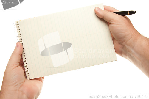 Image of Male Hands Holding Pen and Pad of Paper