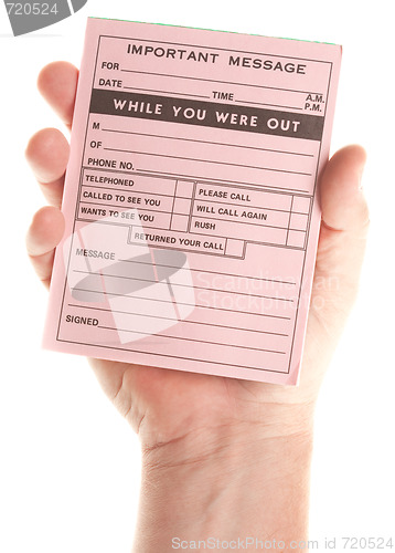 Image of Male Hand Holding Blank Pink Message Pad