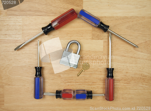Image of House Shaped by Screwdrivers with Lock and Key
