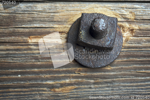 Image of Antique Rusty Bolt, Washer and Wood