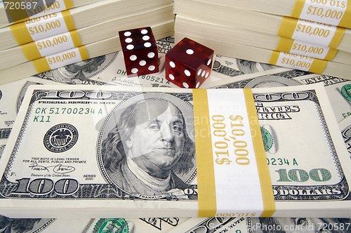 Image of One Hundred Dollar Bills & Red Dice