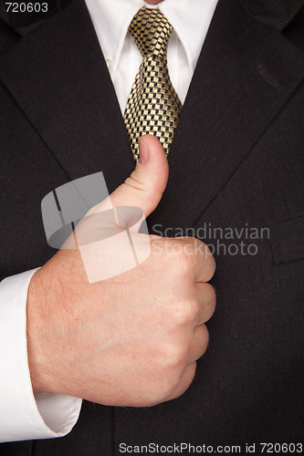 Image of Businessman Gesturing Thumbs Up with Hand