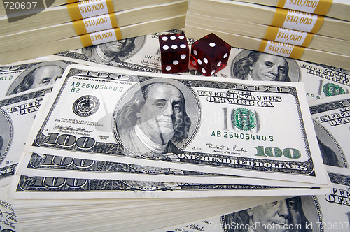 Image of One Hundred Dollar Bills & Red Dice