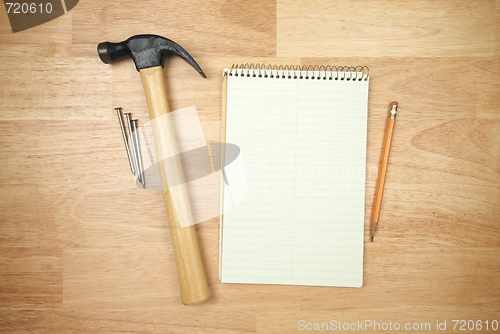 Image of Pad of Paper, Pencil, Hammer and Nails