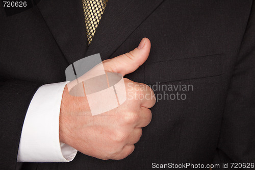 Image of Businessman Gesturing Thumbs Up with Hand