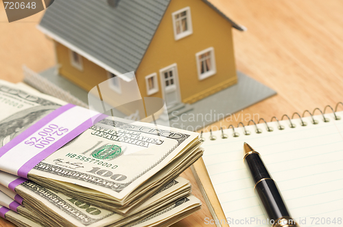 Image of House and Money with Pad and Pen