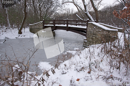 Image of Beautiful Wooden Bridge Over Frozen Stream