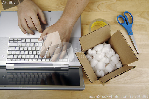 Image of Businessman Works on Laptop 