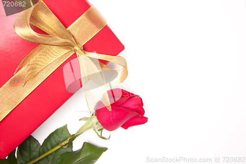 Image of Gift with Gold Ribbon and Rose on White