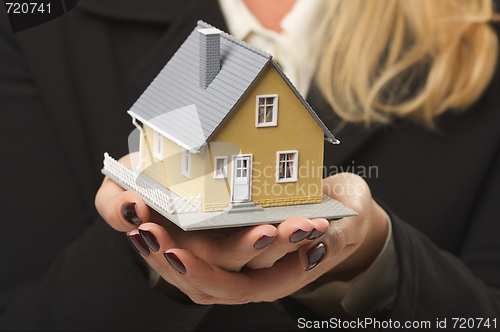 Image of House in Female Hands